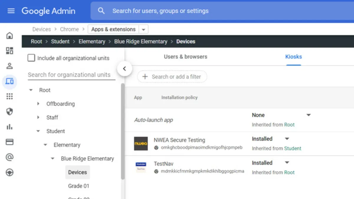School administrator using Google Admin console rollout plan for school administrators on laptop