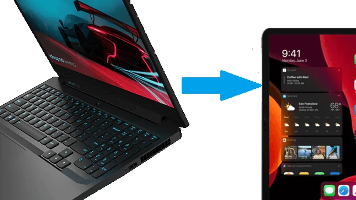 Person switching from Windows laptops to Android tablets using both devices on a desk