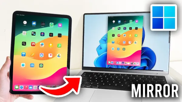 Person switching from iPads to Windows laptops working with both devices on desk